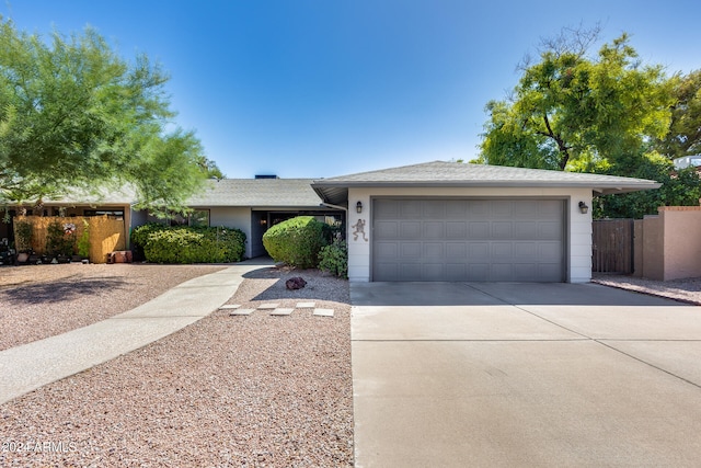 single story home with a garage