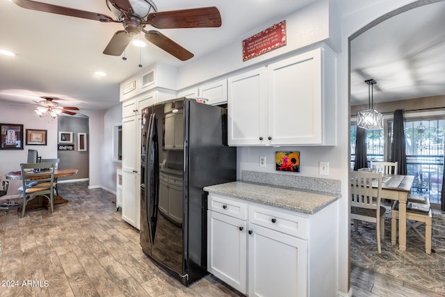 kitchen with ceiling fan, white cabinets, and black refrigerator with ice dispenser