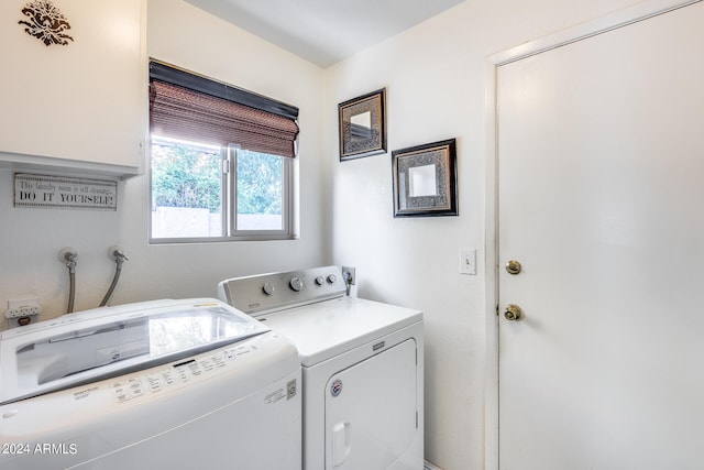 clothes washing area with washer and clothes dryer