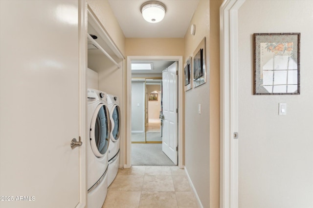 washroom with light tile patterned flooring and washing machine and dryer