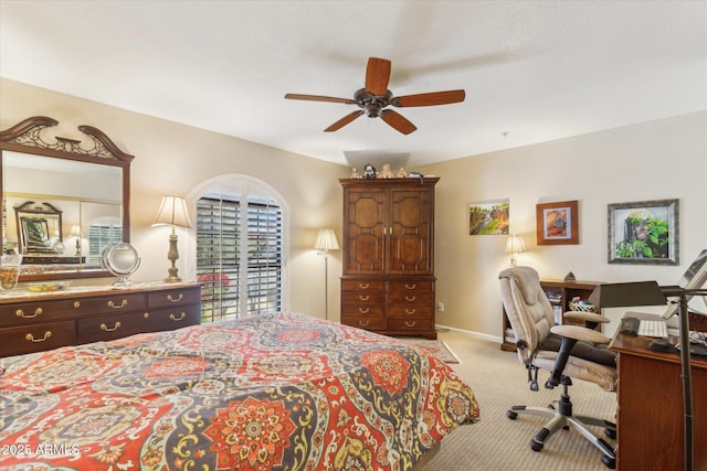 bedroom featuring ceiling fan and light carpet