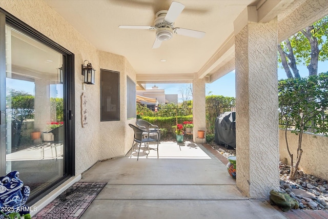 view of patio with grilling area and ceiling fan