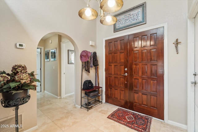 entryway with light tile patterned floors