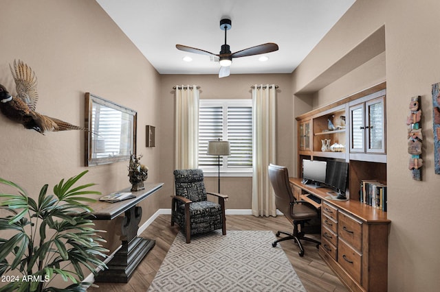 home office featuring ceiling fan and light hardwood / wood-style floors