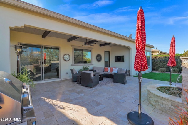 view of patio / terrace with an outdoor living space, ceiling fan, and a grill