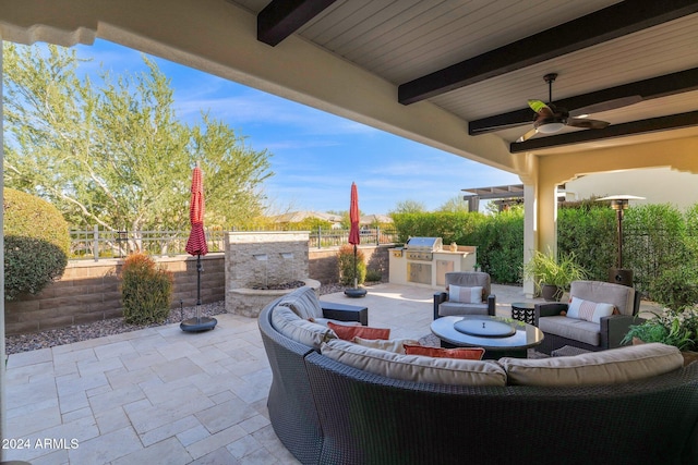 view of patio featuring area for grilling, an outdoor living space, and ceiling fan