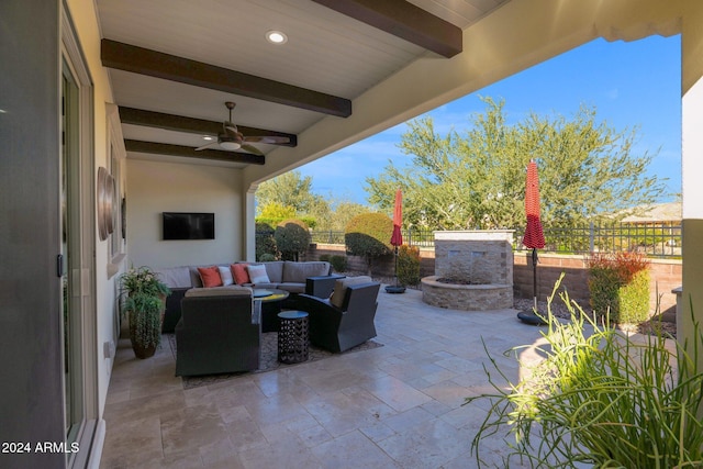 view of patio featuring an outdoor living space and ceiling fan