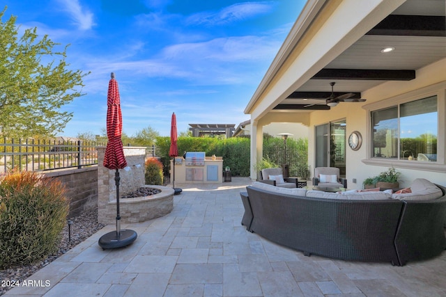 view of patio featuring outdoor lounge area, ceiling fan, area for grilling, and grilling area