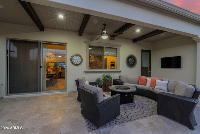 patio terrace at dusk with outdoor lounge area and ceiling fan