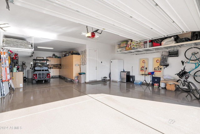 garage featuring a garage door opener