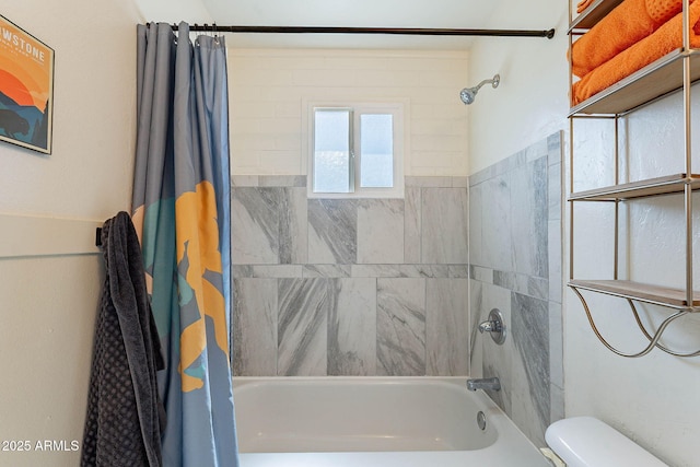 bathroom featuring shower / bathtub combination with curtain and toilet