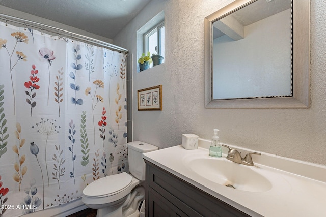 full bathroom featuring shower / bath combination with curtain, vanity, and toilet