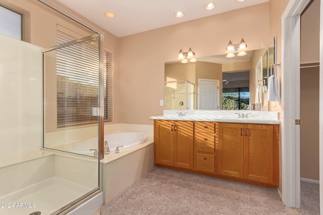 bathroom with a wealth of natural light, vanity, and plus walk in shower