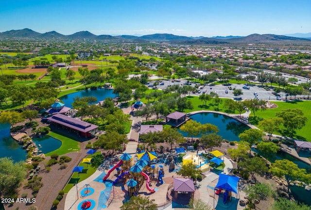 birds eye view of property featuring a water and mountain view