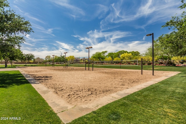 view of home's community featuring volleyball court and a yard