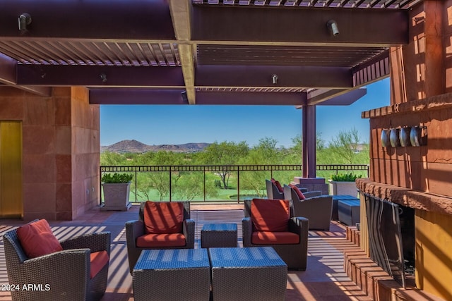 view of patio / terrace with an outdoor hangout area, a pergola, and a mountain view