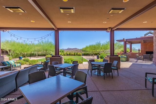 view of patio / terrace featuring a mountain view