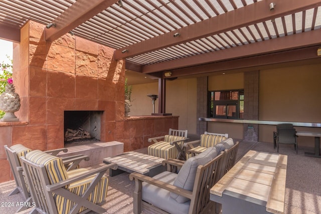 view of patio / terrace with an outdoor living space with a fireplace