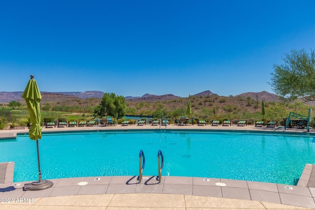 view of pool with a mountain view