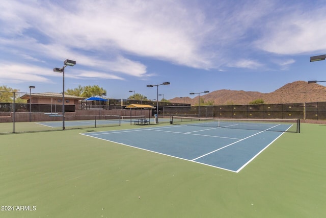 view of sport court with a mountain view