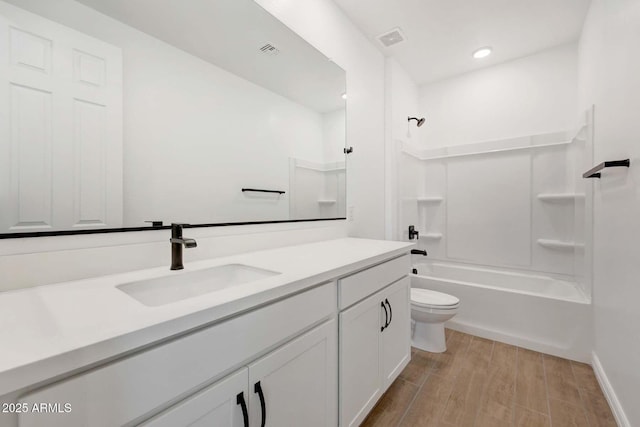 full bathroom featuring shower / bathtub combination, vanity, toilet, and hardwood / wood-style floors