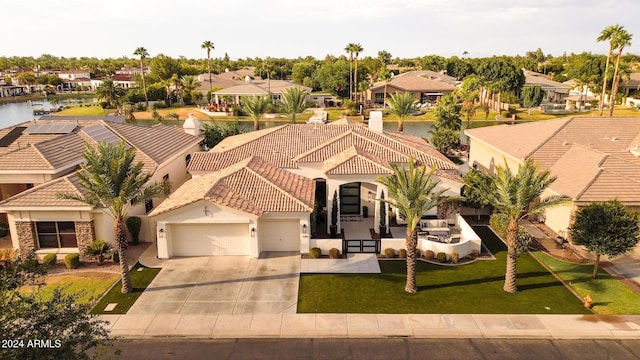 view of front of property with a water view