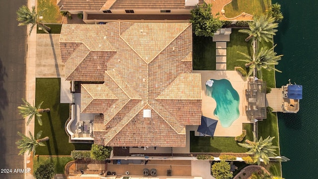 birds eye view of property with a water view