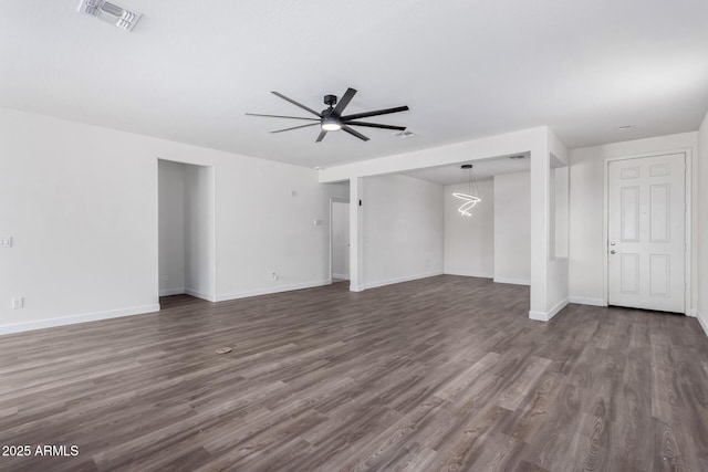 unfurnished room featuring dark hardwood / wood-style flooring and ceiling fan