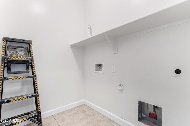 washroom with gas dryer hookup, hookup for a washing machine, hookup for an electric dryer, and light tile patterned flooring