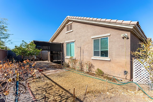 view of property exterior with a carport