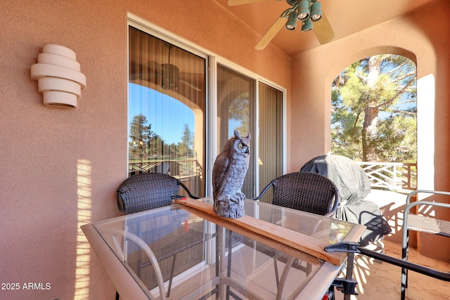 view of patio / terrace featuring ceiling fan