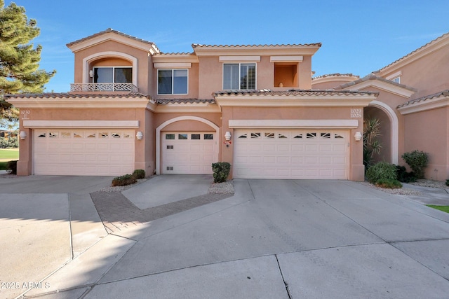 mediterranean / spanish-style house featuring a garage