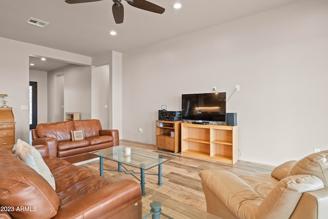 living room with ceiling fan and light hardwood / wood-style floors