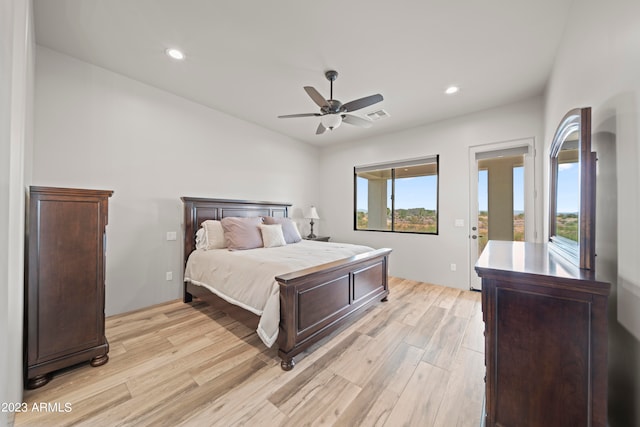 bedroom with ceiling fan, light hardwood / wood-style flooring, and access to exterior