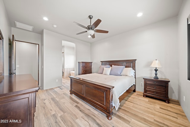 bedroom with light hardwood / wood-style floors and ceiling fan