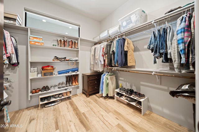 walk in closet featuring light hardwood / wood-style flooring