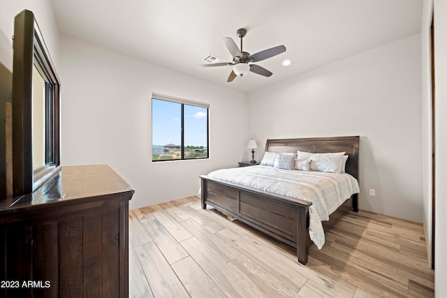 bedroom featuring light hardwood / wood-style floors and ceiling fan