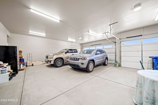 garage with black fridge