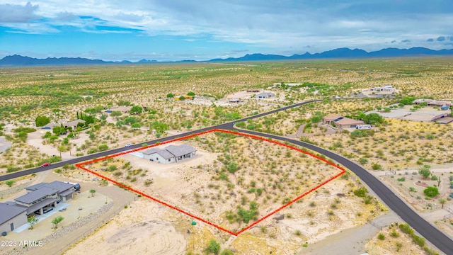 birds eye view of property with a mountain view