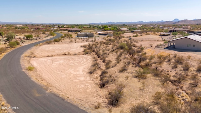 birds eye view of property with a mountain view