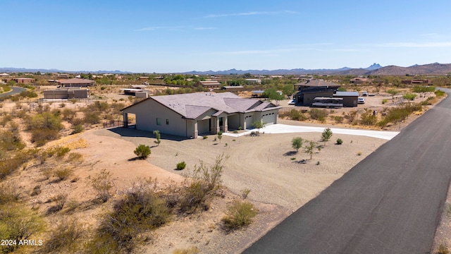 birds eye view of property with a mountain view