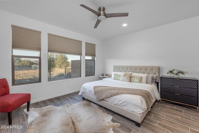 bedroom featuring ceiling fan and hardwood / wood-style flooring