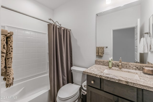 full bathroom with shower / bath combo with shower curtain, vanity, and toilet