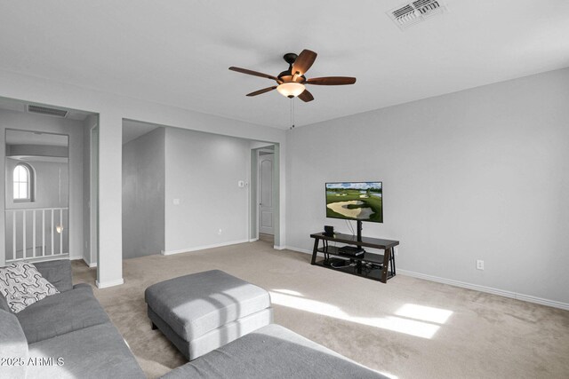 living room with light carpet and ceiling fan