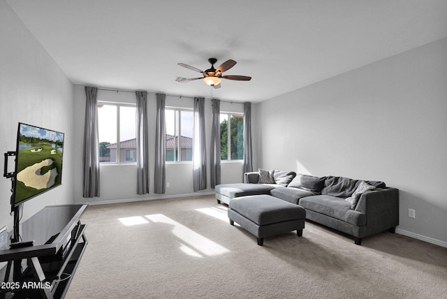 living room with ceiling fan and light carpet