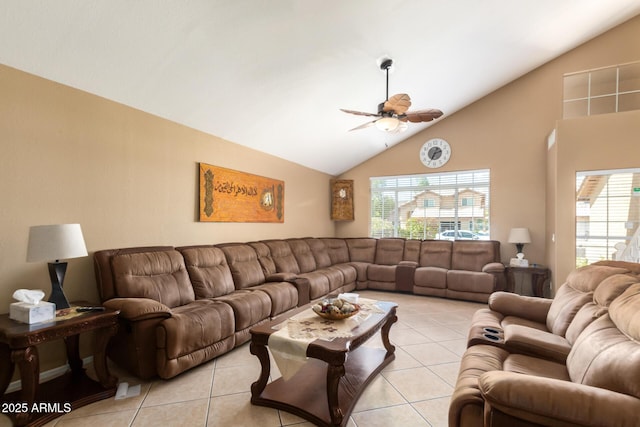 living room with ceiling fan, high vaulted ceiling, and light tile patterned flooring