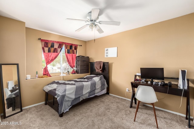 bedroom with a ceiling fan, carpet flooring, and baseboards