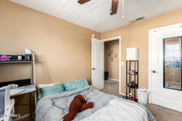 carpeted bedroom featuring visible vents, ceiling fan, and baseboards