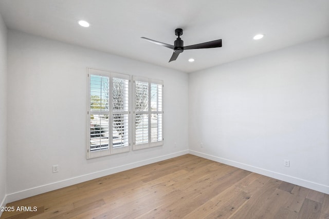 unfurnished room featuring light hardwood / wood-style floors and ceiling fan