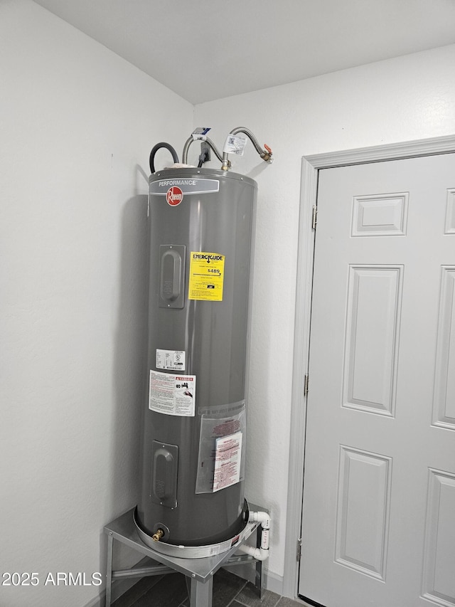 utility room with water heater